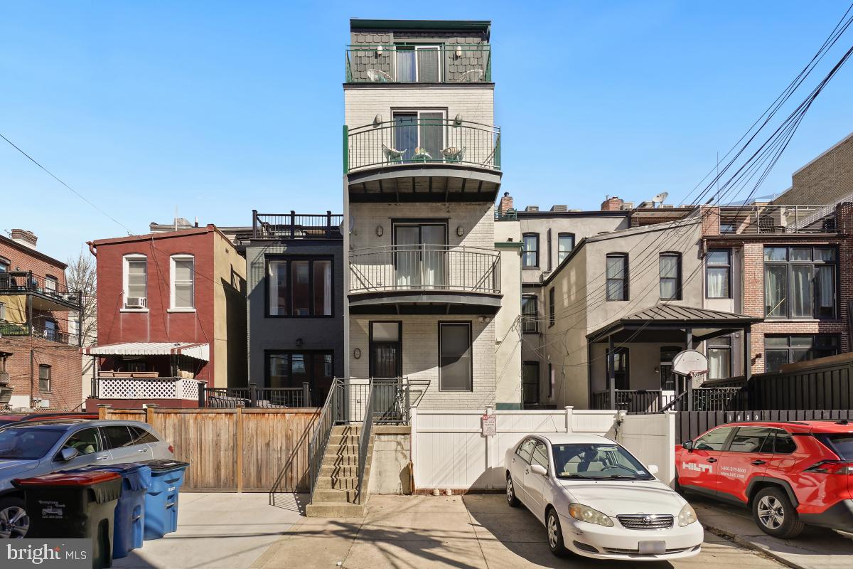 1832 Swann Street Northwest, Unit D Washington, DC 20009 - Photo 24 of 29 a car parked in front of a house