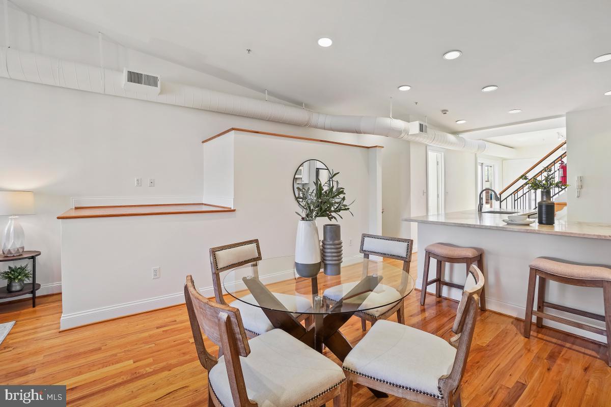 1832 Swann Street Northwest, Unit D Washington, DC 20009 - Photo 8 of 29 a dining room with furniture and wooden floor