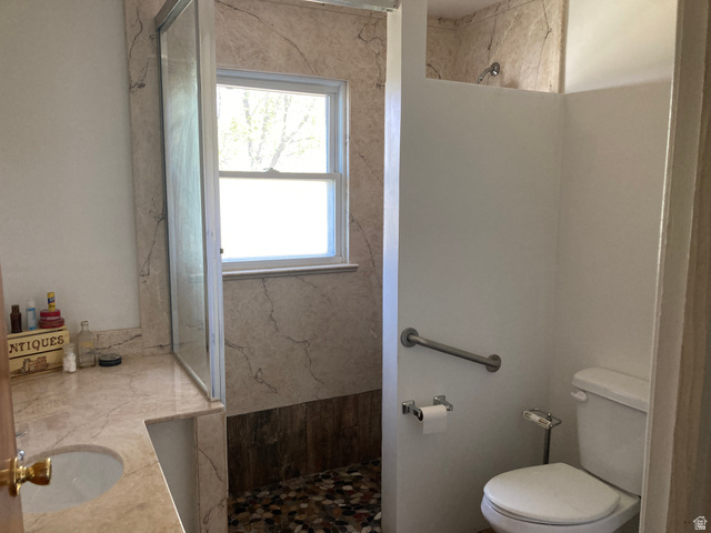 200 South 2800th Street West Ogden, UT 84404 - Photo 13 of 42 Full bathroom featuring a marble finish shower and vanity