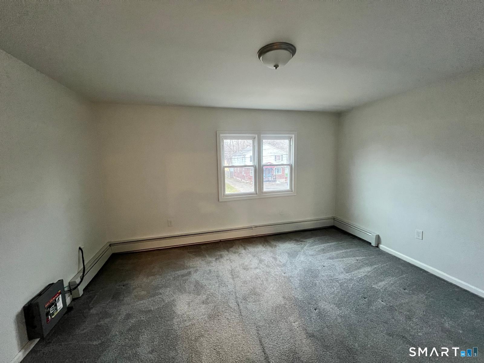 34 Norman Street Manchester, CT 06040 - Photo 15 of 19 an empty room with a window