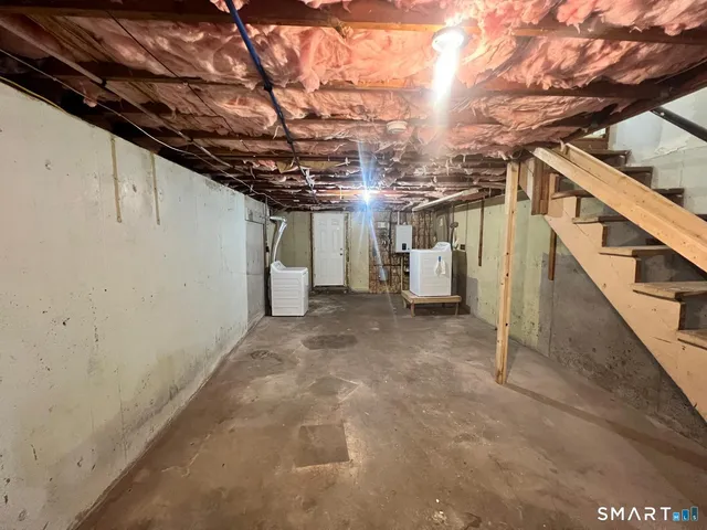 a view of a room with wooden walls