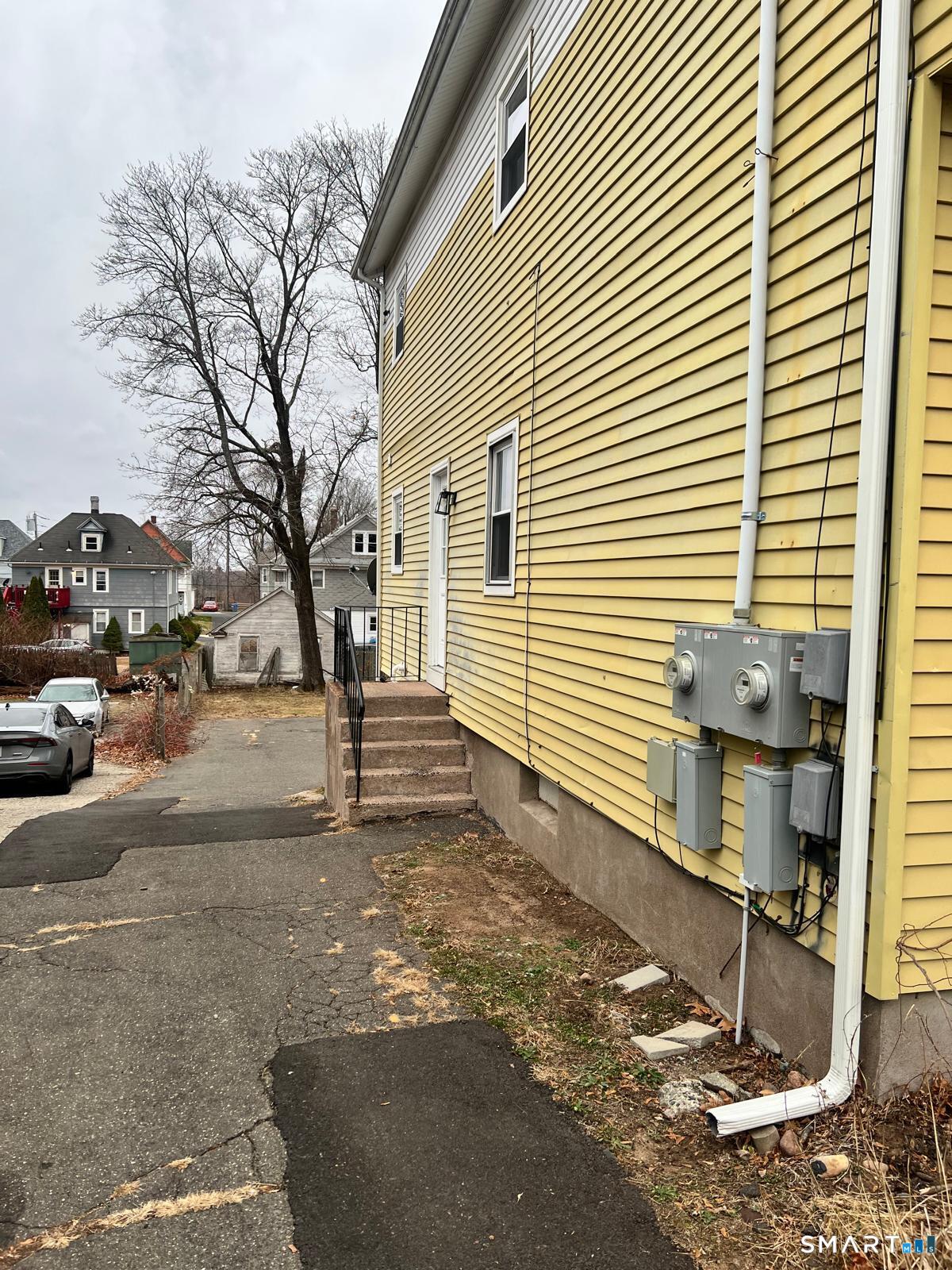 34 Norman Street Manchester, CT 06040 - Photo 18 of 19 a view of a street with cars on road