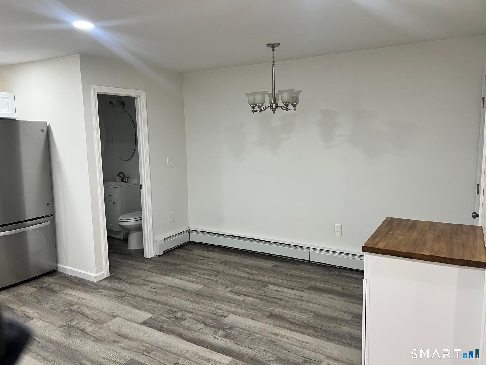 34 Norman Street Manchester, CT 06040 - Photo 5 of 19 a view of empty room with wooden floor and window