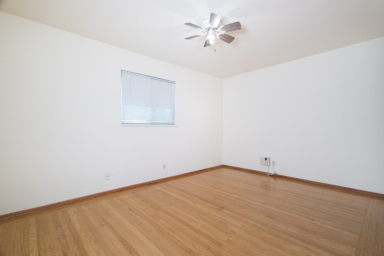 2855 La Colina Way Carmichael, CA 95608 - Photo 13 of 25 an empty room with a window and a ceiling fan