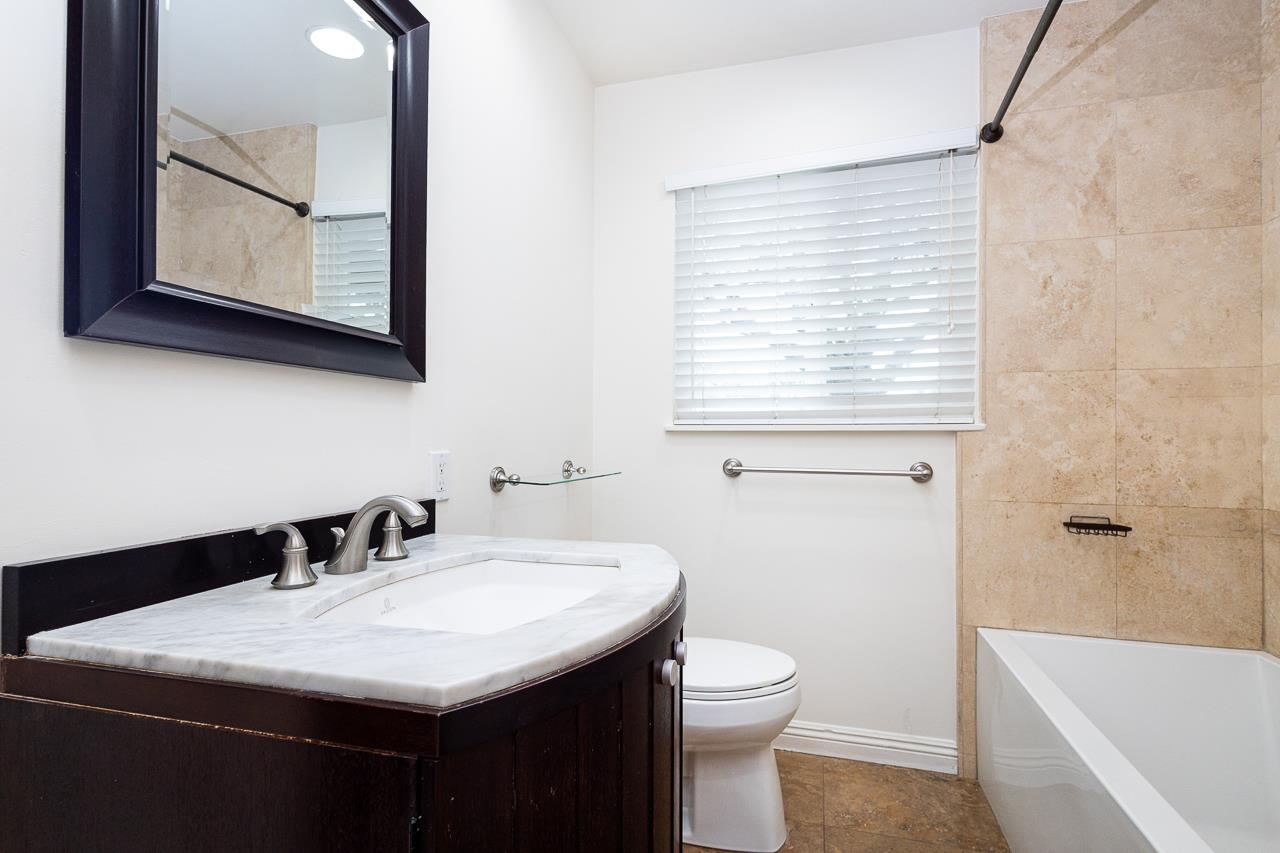 2855 La Colina Way Carmichael, CA 95608 - Photo 14 of 25 a bathroom with a sink and a mirror