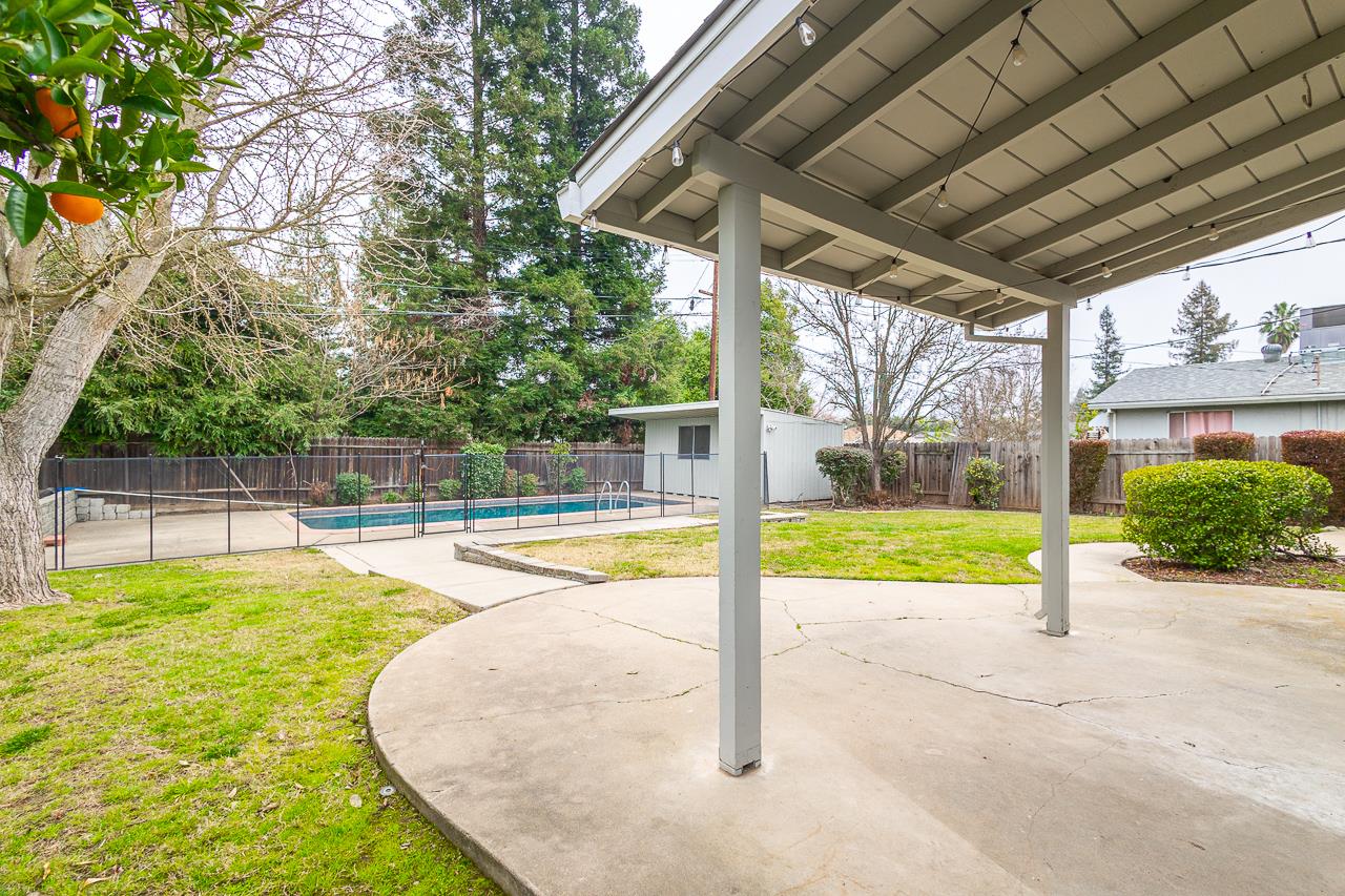 2855 La Colina Way Carmichael, CA 95608 - Photo 16 of 25 a view of a swimming pool with a porch and trees