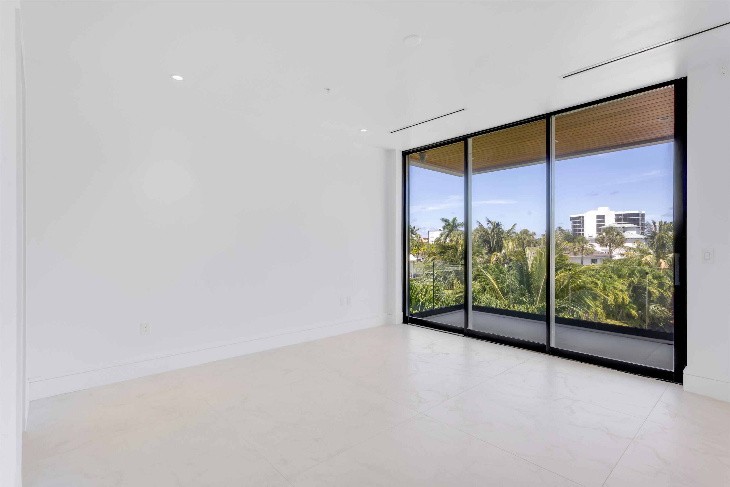900 Lago Mar Lane, Unit PH Boca Raton, FL 33431 - Photo 26 of 58 a view of an empty room with a floor to ceiling window