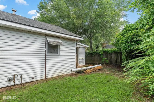 a backyard of a house with lots of green space