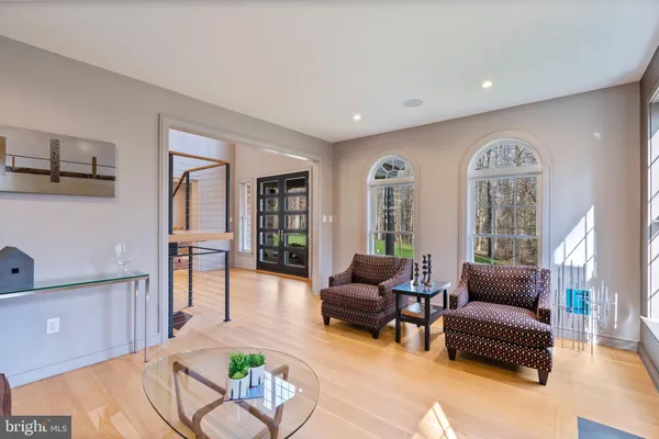 a living room with furniture and a book shelf