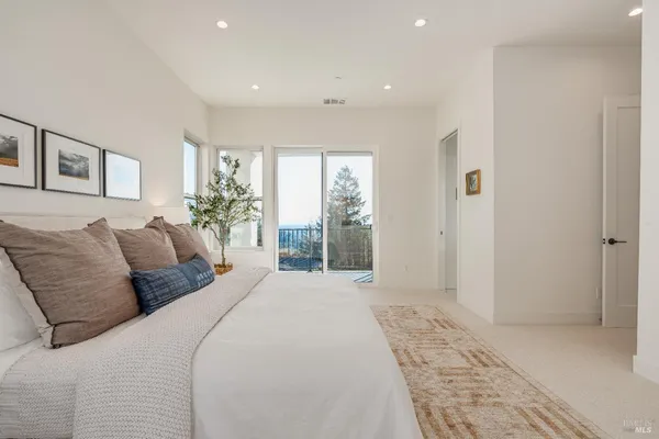 a view of an empty room with glass door