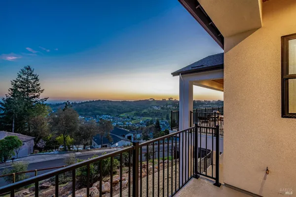 a view of a balcony with city view