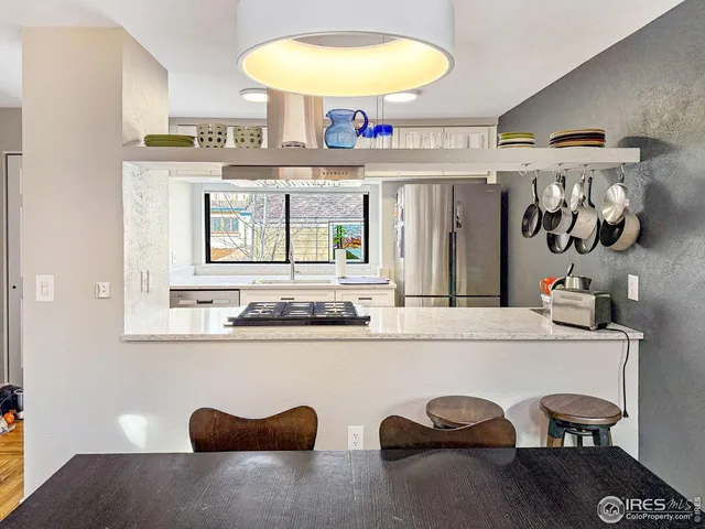 a kitchen with a sink and a stove