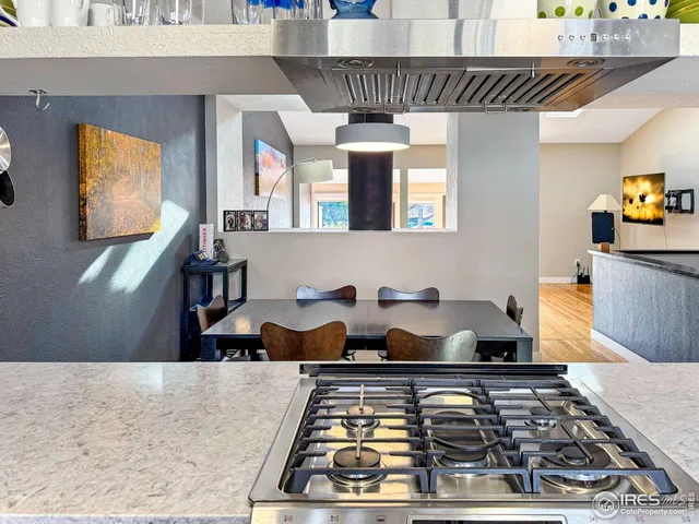 a kitchen with stove and cabinets