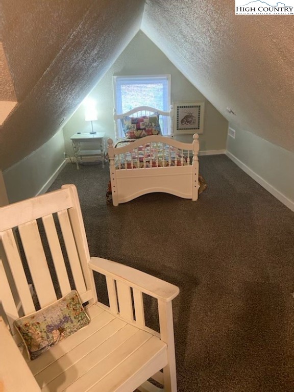 392 Old Danner Road Vilas, NC 28692 - Photo 20 of 34 a bedroom with a bed and a dresser