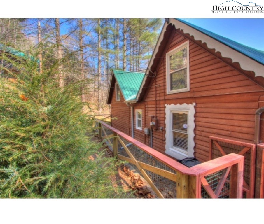 392 Old Danner Road Vilas, NC 28692 - Photo 24 of 34 a backyard of a house with lots of green space