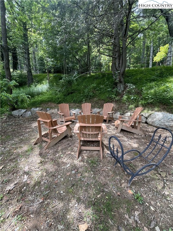 392 Old Danner Road Vilas, NC 28692 - Photo 30 of 34 a view of a tables and chairs in a backyard