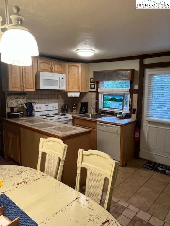 392 Old Danner Road Vilas, NC 28692 - Photo 8 of 34 a kitchen with a sink a counter top space and stainless steel appliances
