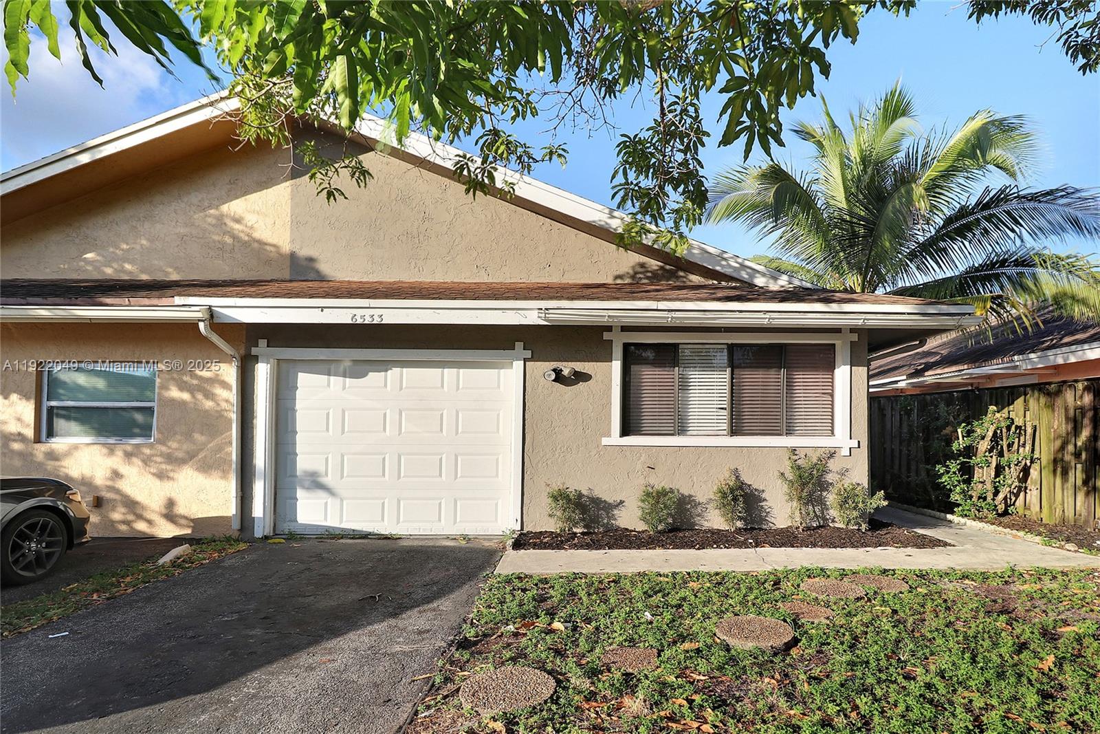 6533 Harbour Road North Lauderdale, FL 33068 - Photo 1 of 20 a front view of a house with a yard