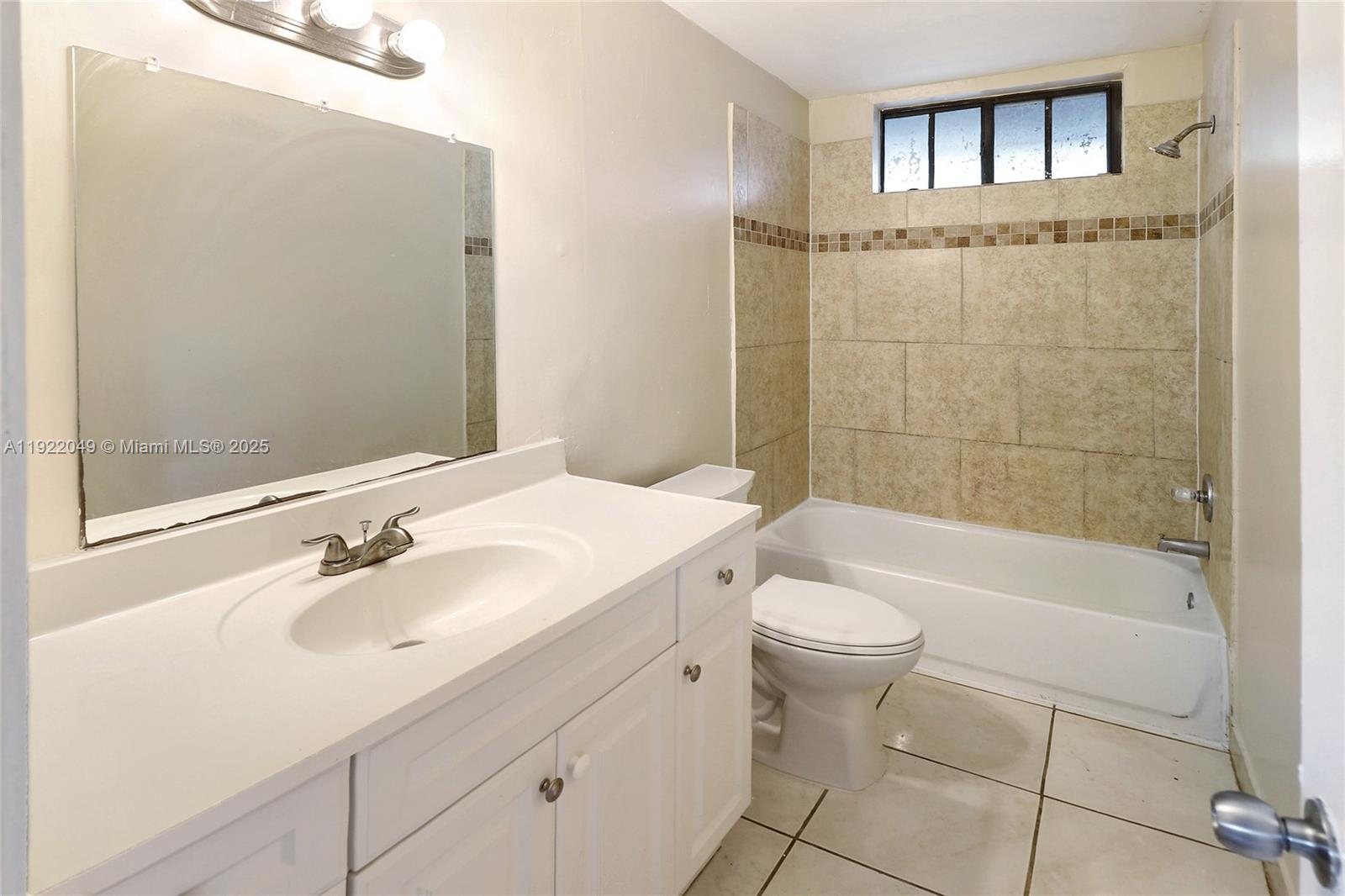 6533 Harbour Road North Lauderdale, FL 33068 - Photo 13 of 20 a bathroom with a sink a toilet and shower