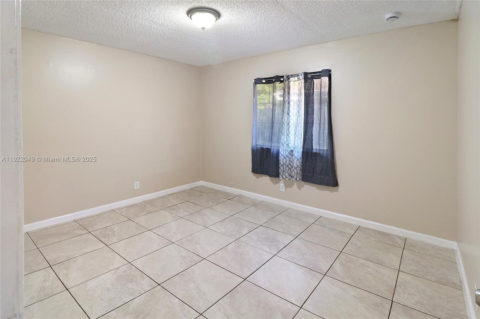6533 Harbour Road North Lauderdale, FL 33068 - Photo 14 of 20 a view of an empty room and window