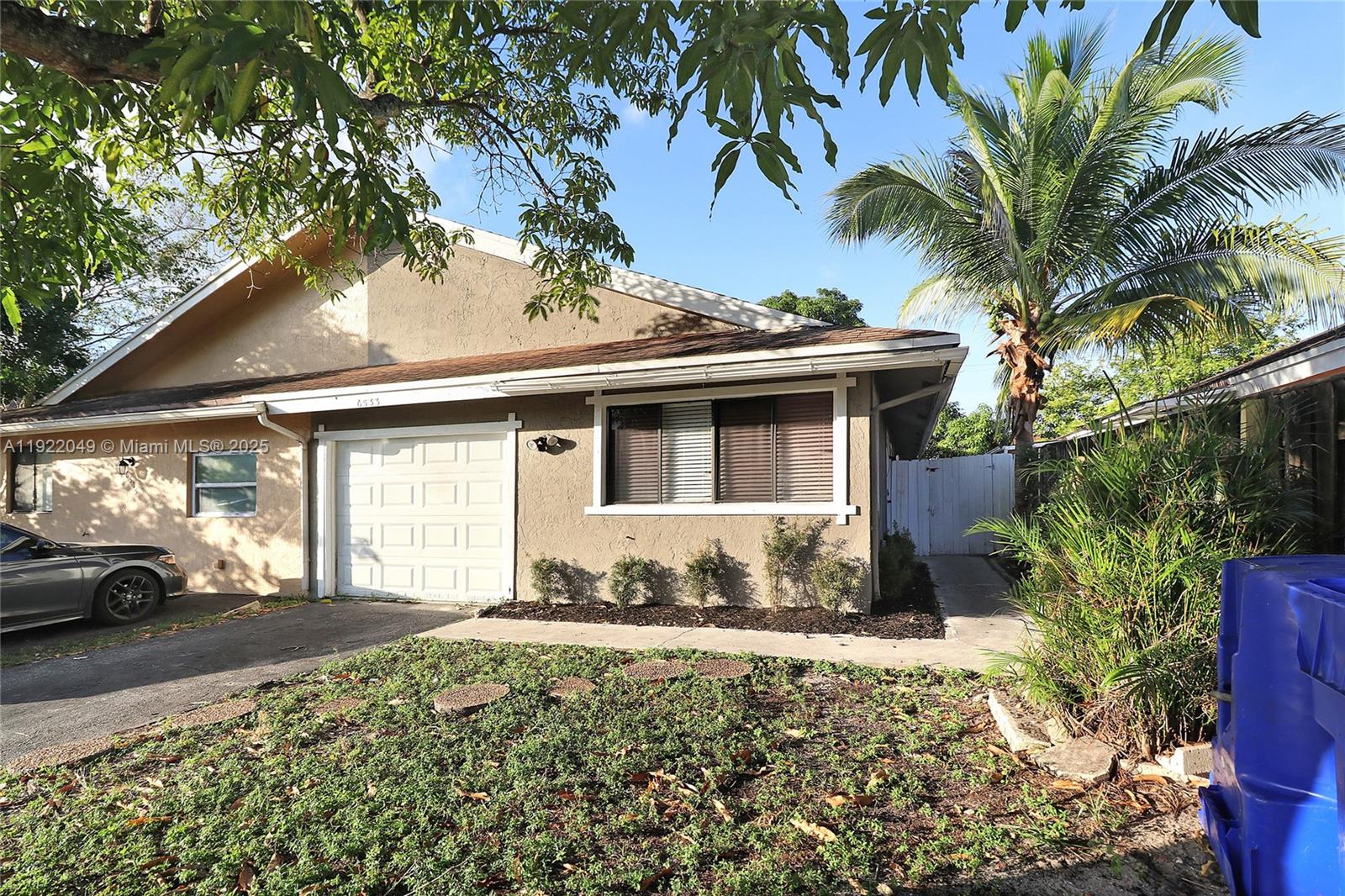 6533 Harbour Road North Lauderdale, FL 33068 - Photo 2 of 20 a view of a house with a yard and sitting area