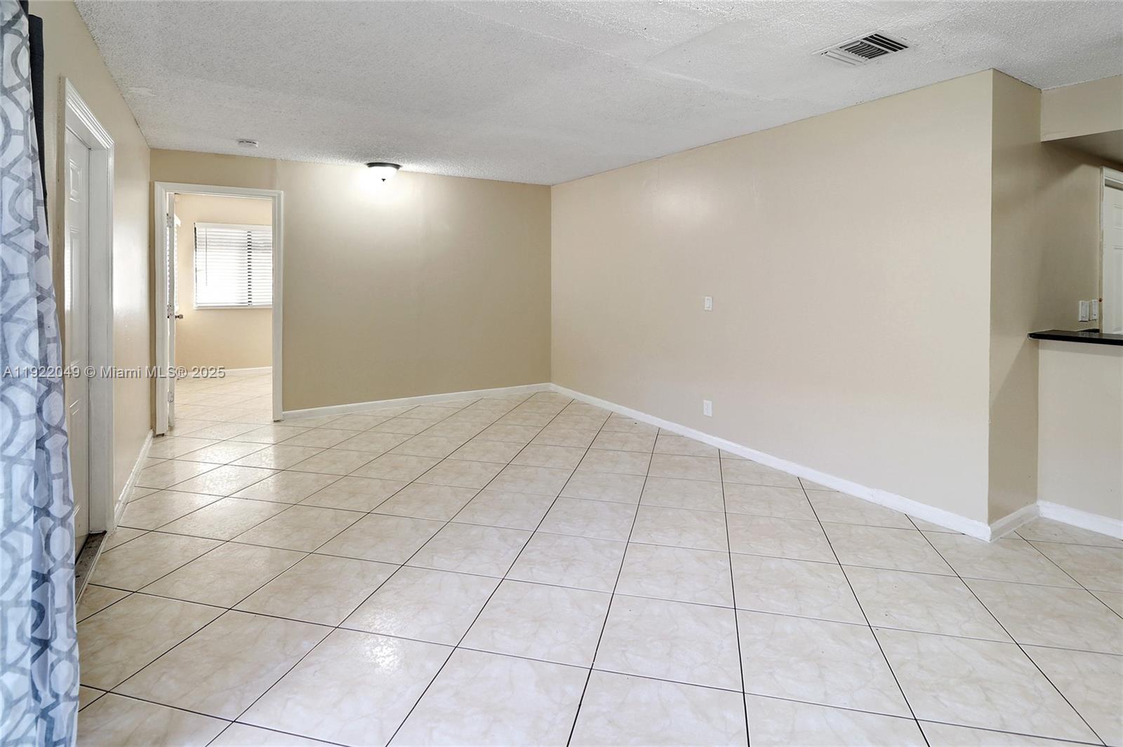 6533 Harbour Road North Lauderdale, FL 33068 - Photo 8 of 20 a view of an empty room and window