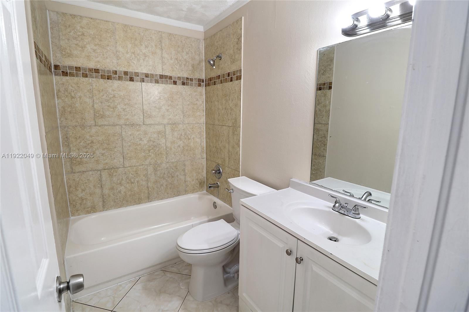 6533 Harbour Road North Lauderdale, FL 33068 - Photo 10 of 20 a bathroom with a sink a toilet and shower