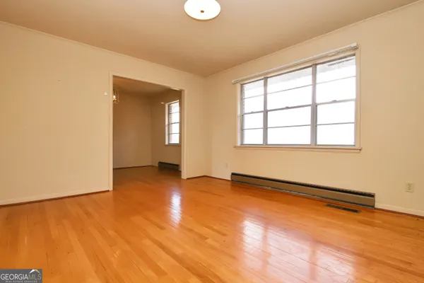 a view of an empty room with a window