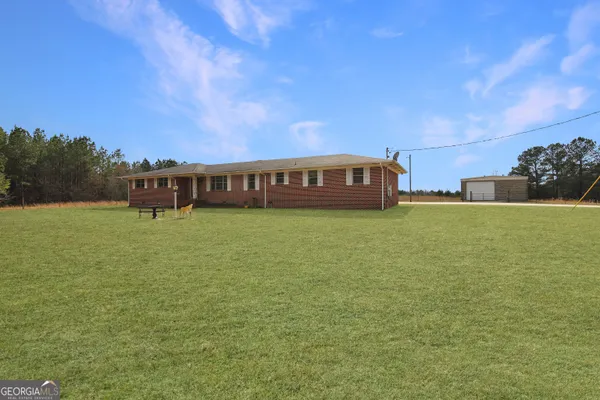 a backyard of a house with lots of green space