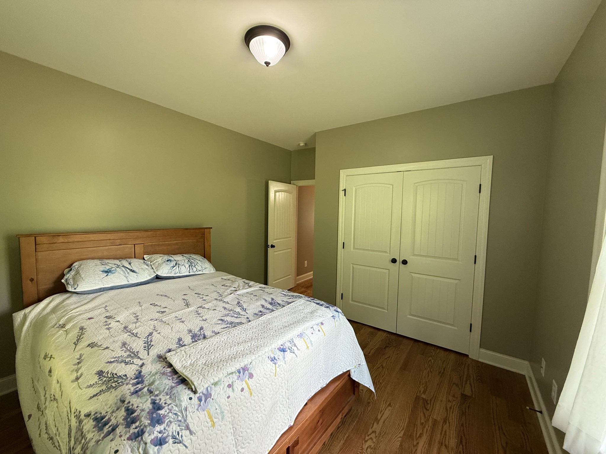 6591 Clear Creek Road Pulaski, TN 38478 - Photo 19 of 40 a bedroom with a bed and wooden floor