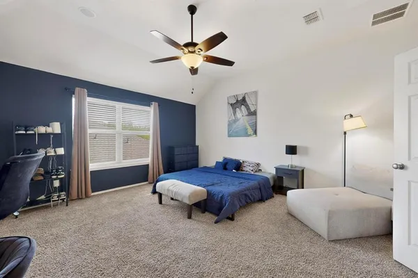 a bedroom with bed and window