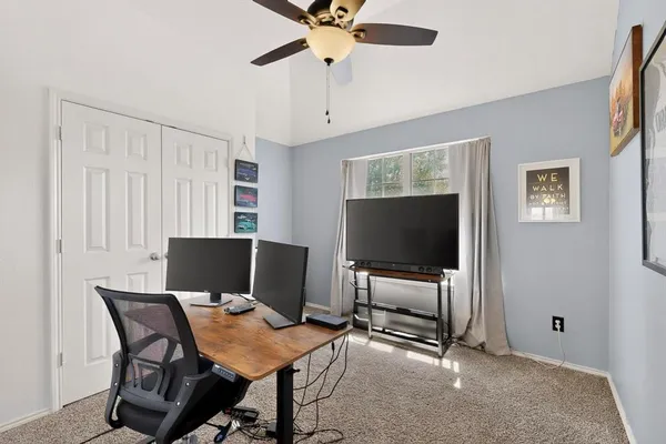 a view of a livingroom with furniture and a flat screen tv