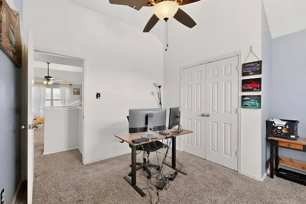 a workspace with furniture and a window