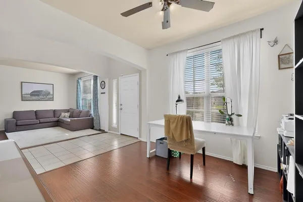 a living room with furniture and a window