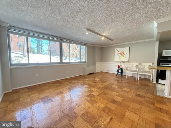 a view of livingroom with workspace and window