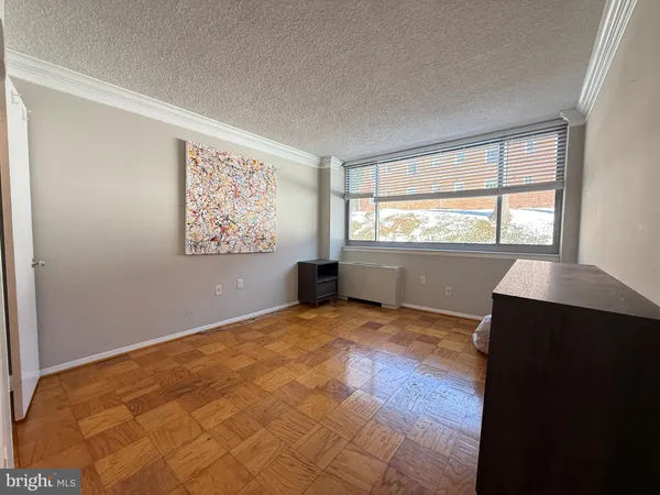a view of an empty room with a window