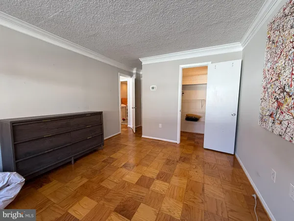a view of room with window and hardwood floor