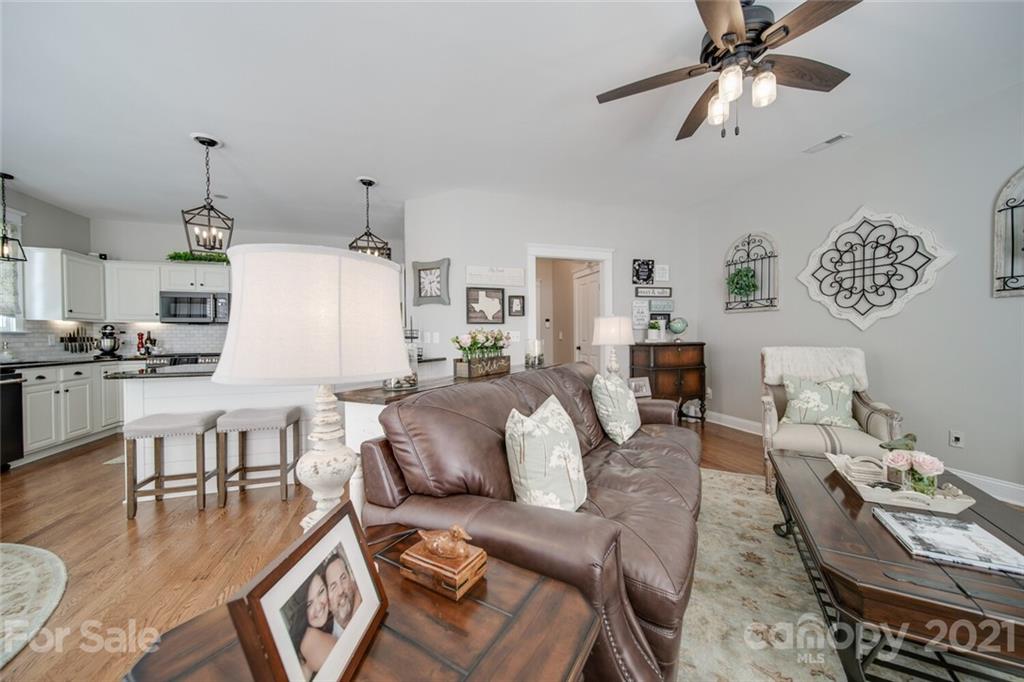 2513 Lower Assembly Drive Fort Mill, SC 29708 - Photo 22 of 47 a living room with furniture and a chandelier