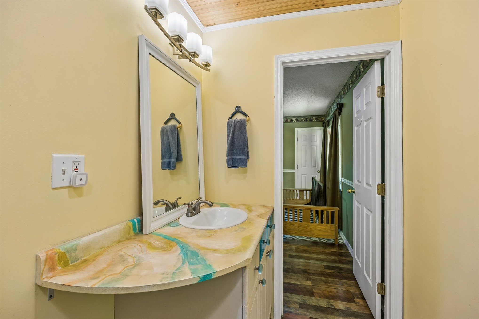 85013 Avant Road Yulee, FL 32097 - Photo 15 of 46 a bathroom with a sink and a mirror
