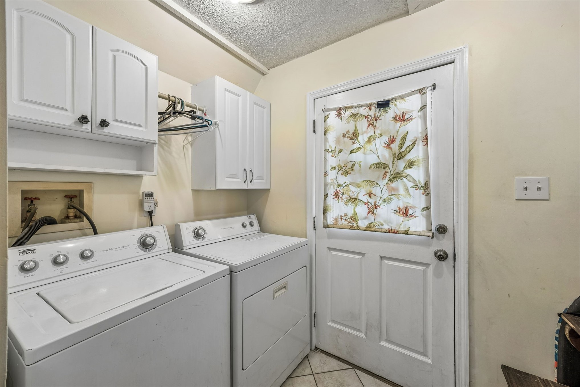 85013 Avant Road Yulee, FL 32097 - Photo 19 of 46 a utility room with dryer and washer