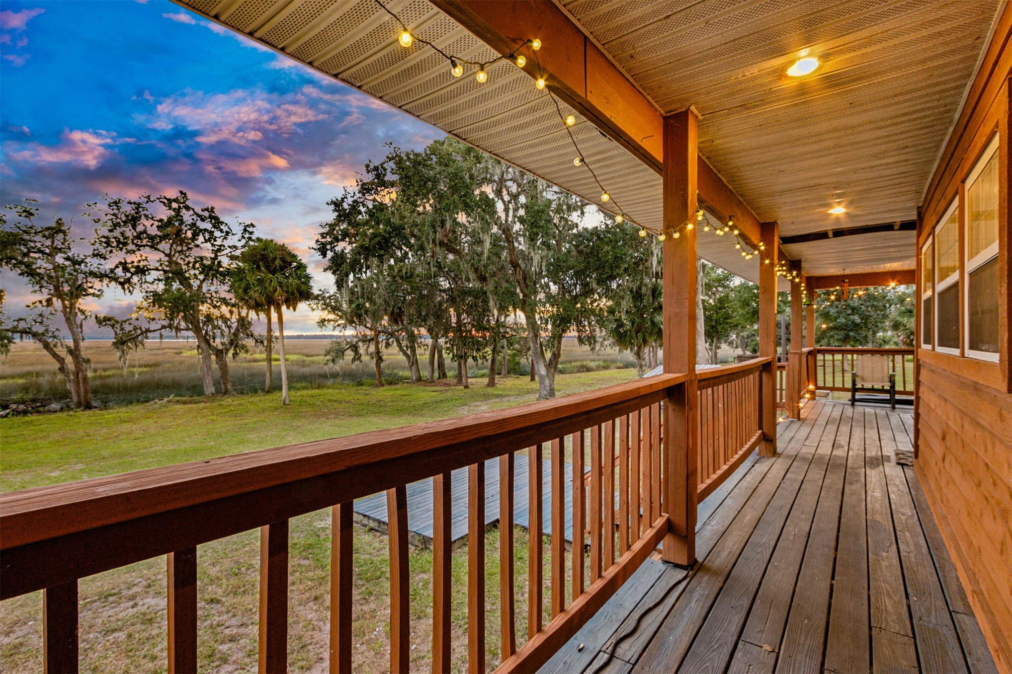 85013 Avant Road Yulee, FL 32097 - Photo 24 of 46 a view of balcony with wooden floor and fence