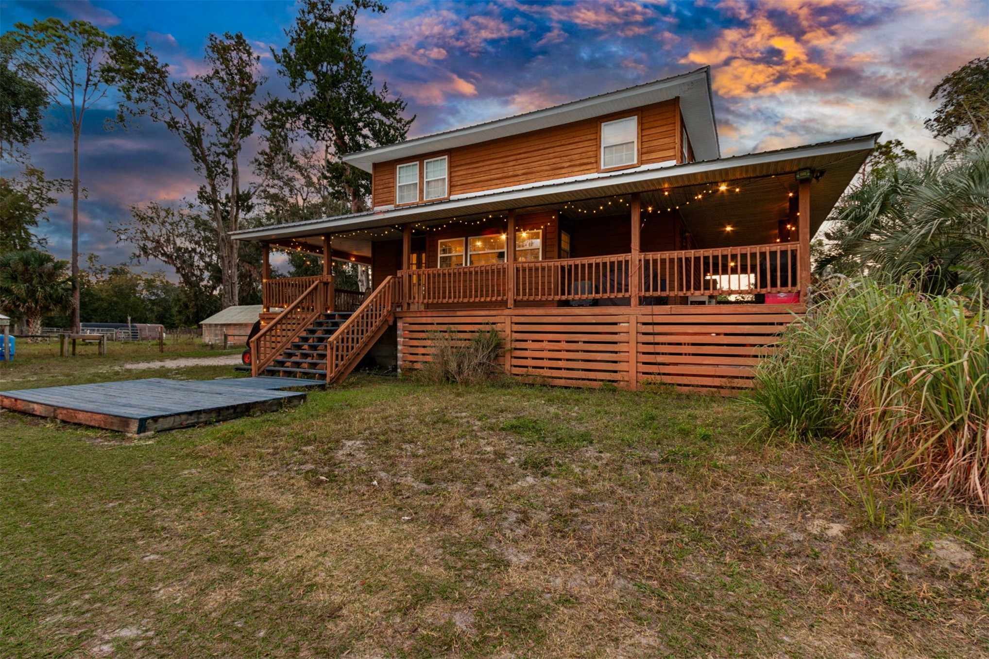 85013 Avant Road Yulee, FL 32097 - Photo 26 of 46 a view of a house with backyard and sitting area
