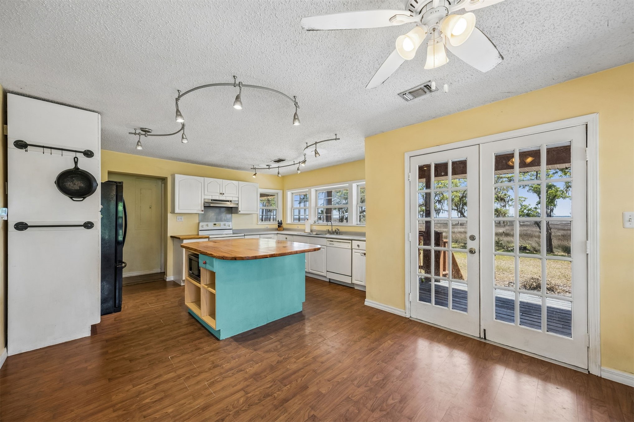 85013 Avant Road Yulee, FL 32097 - Photo 7 of 46 a kitchen with stainless steel appliances granite countertop a lot of counter space and wooden floor