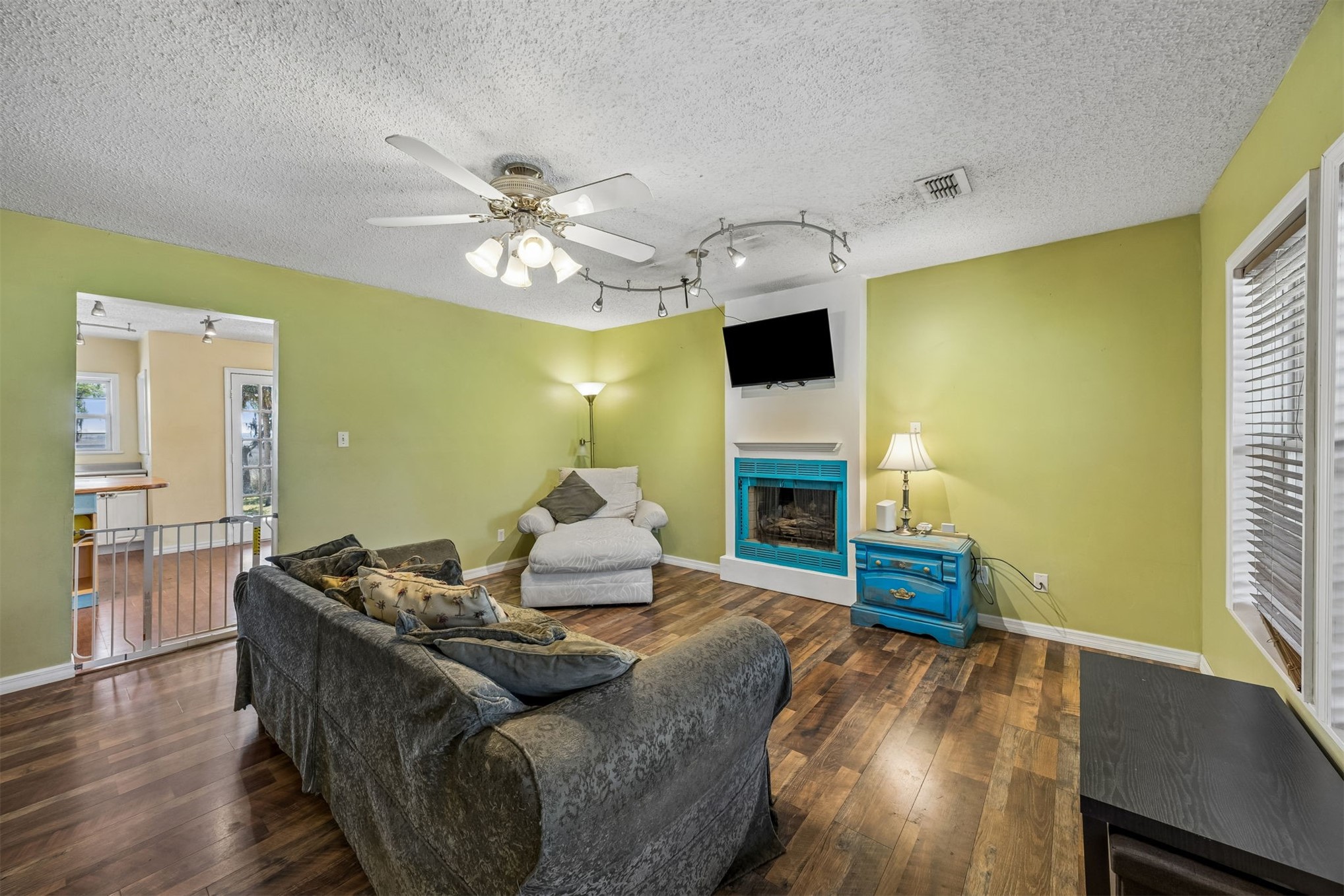 85013 Avant Road Yulee, FL 32097 - Photo 8 of 46 a living room with furniture fireplace and a flat screen tv