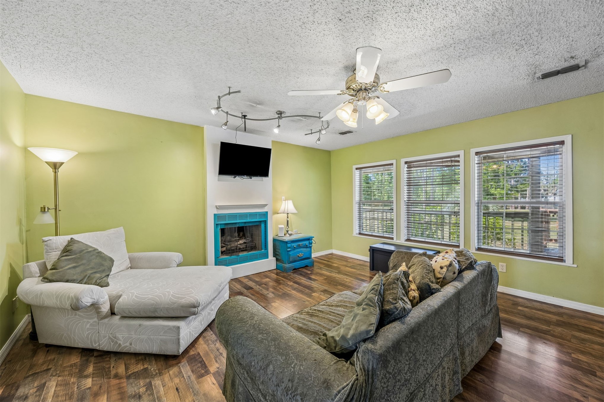85013 Avant Road Yulee, FL 32097 - Photo 9 of 46 a living room with furniture and a fireplace