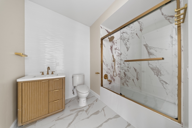 17 Wickham Street, Unit 203 Passaic, NJ 07055 - Photo 11 of 15 a bathroom with a toilet sink and shower