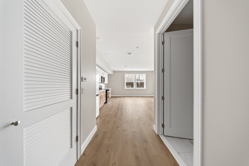 17 Wickham Street, Unit 203 Passaic, NJ 07055 - Photo 5 of 15 a view of a hallway with wooden floor