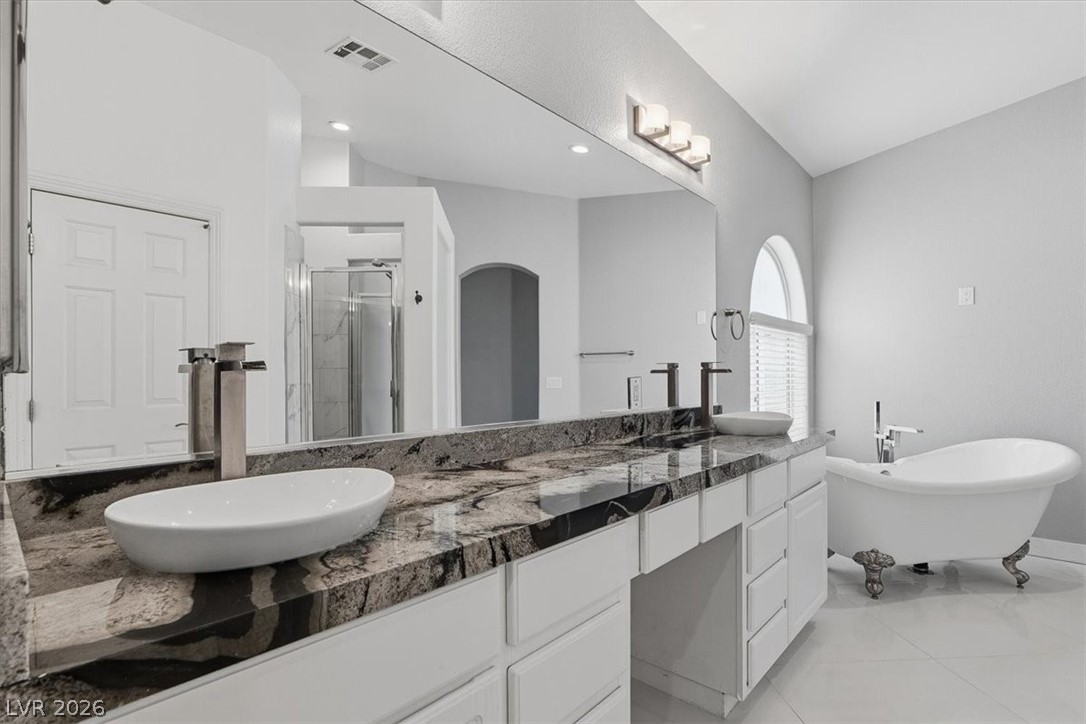 2413 Gold Camp Street Henderson, NV 89002 - Photo 46 of 66 Full bath featuring a marble finish shower, double vanity, and a soaking tub