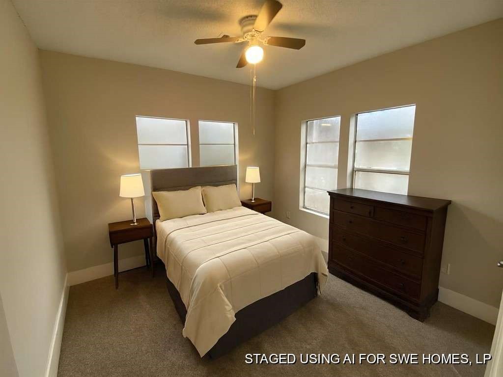 8213 East Erath Street Houston, TX 77012 - Photo 10 of 16 a bedroom with a bed and a closet