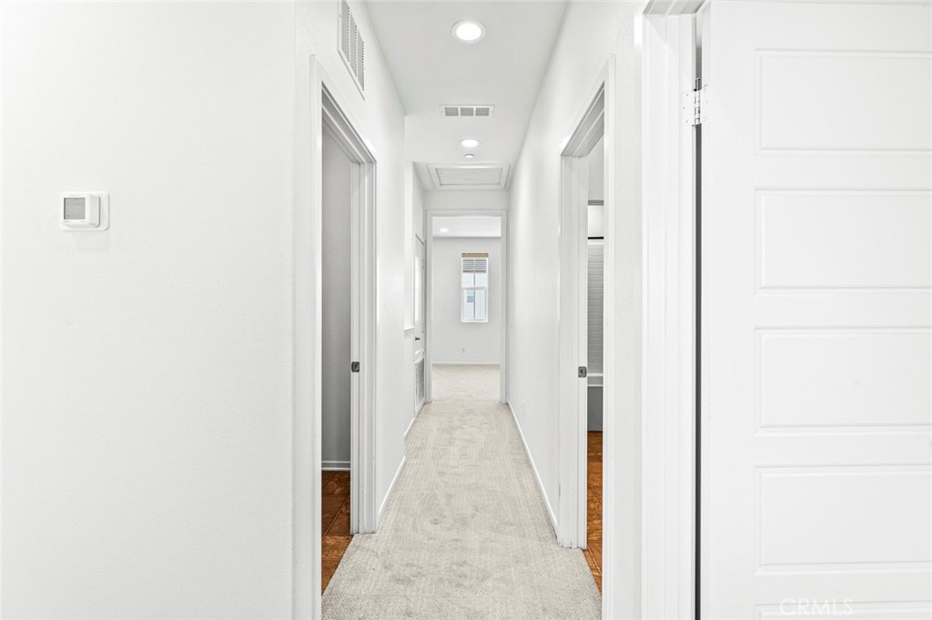 9560 Hammock Place Rancho Cucamonga, CA 91730 - Photo 19 of 48 a view of a hallway with wooden floor